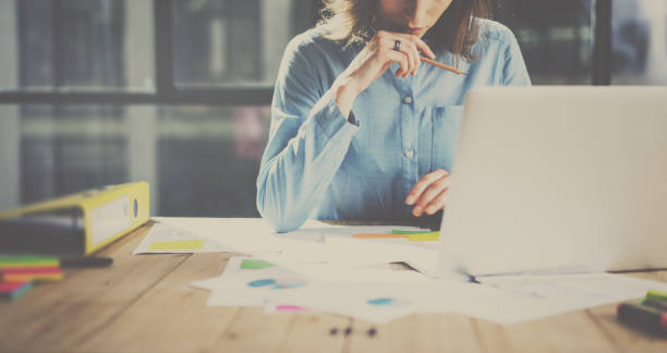 istock Working process at modern office.Account manager working at the wooden table on new business project.Blurred background 815196346