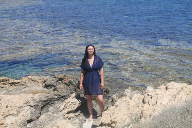 istock The girl on the sea coast 815198902
