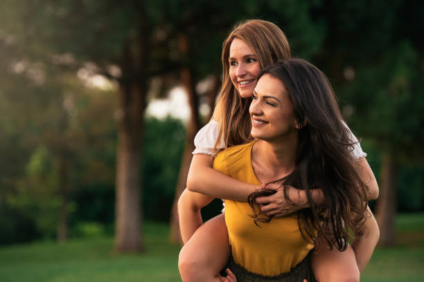 istock Beautiful women having fun in the park. 815202148