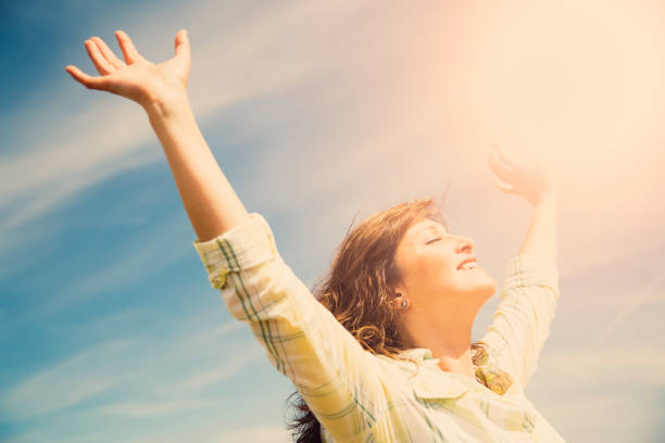 istock Middle aged woman feeling free 815211656