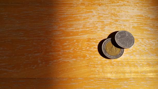 istock Thailand coin on the wooden floor. 815215100