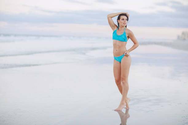 istock beautiful couple on the beach 815224394