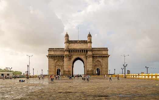 MUMBAI, INDIA - July 09, 2017 - Unidentified people walking  around the Gateway of India