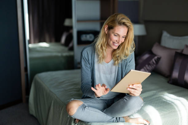 istock Portrait of blond beautiful woman using tablet 815230066