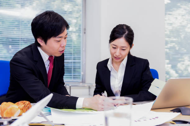 istock Colleagues cooperating to get their work done before their deadline 815235740