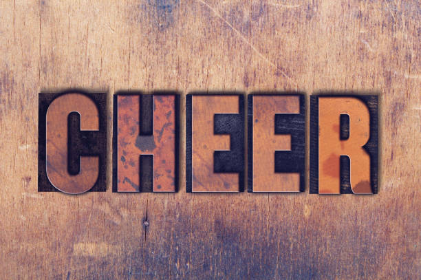 istock Cheer Theme Letterpress Word on Wood Background 815241604
