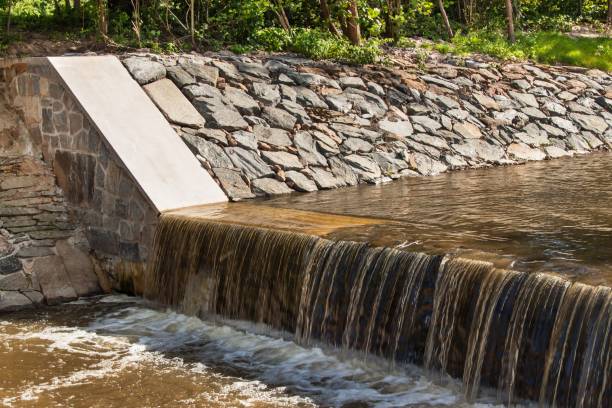 istock Weir on a river. Corrected trough on a rural river in the Czech Republic. 815247914