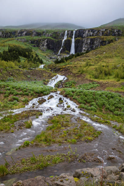 Waterfall in Seyðisfjörður, an Eastern Fjord town in Iceland stock photo