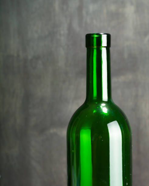 istock High wine glass made from green glass. No content. Low key. 815318912