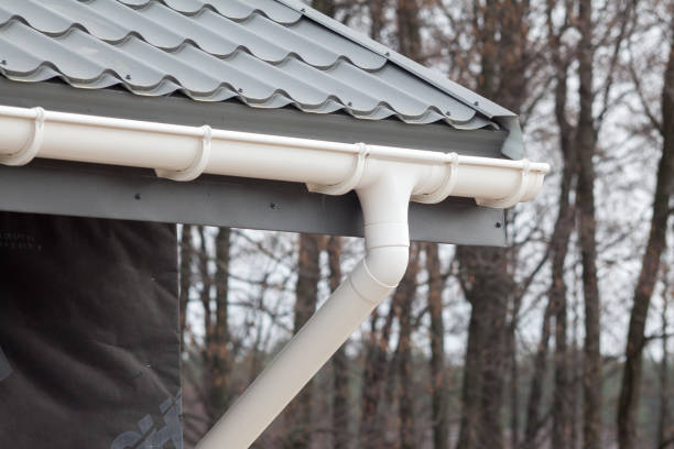 istock New gray metal tile roof with white rain gutter 815318938