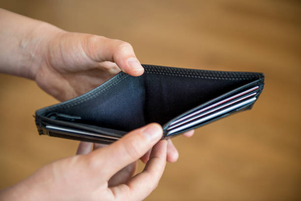 istock High angle view of a man showing his empty wallet 815326330