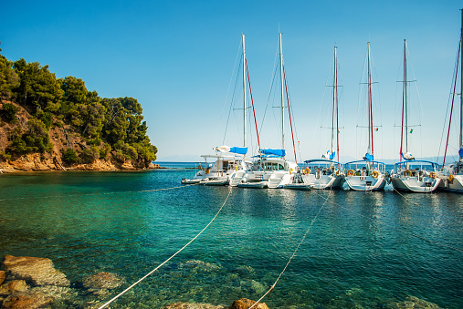 The blue sea with yachts and boats on the water, Skiathos, Greece