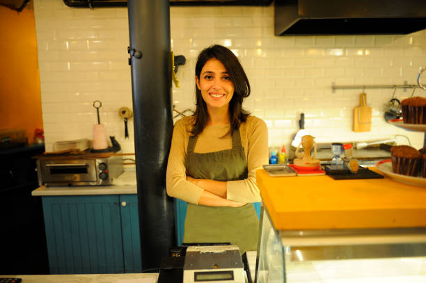 istock Female cashier at coffee shop 815347236