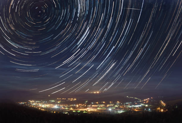 Startrails over the town stock photo
