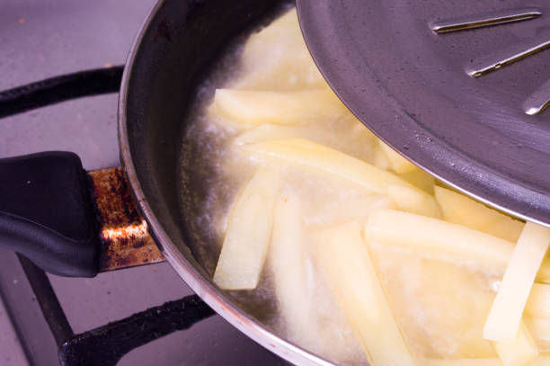istock Potatoes frying in frying pan 815353378