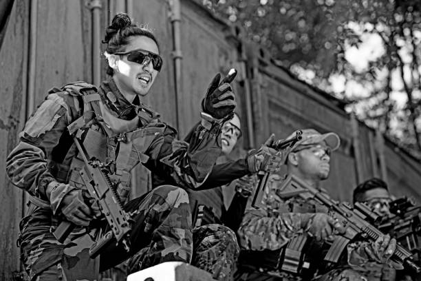 istock Group of 4 soldiers training in outdoor setting 815364766