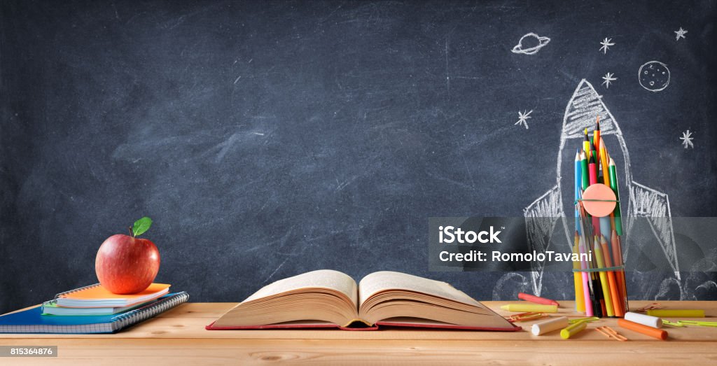 Start School Concept Supplies And Rocket Sketch On Blackboard Education Stock Photo
