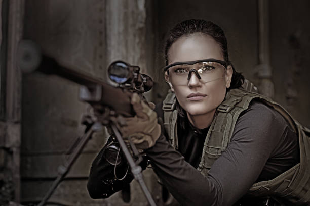 istock Lone brunette female soldier in outdoor setting 815365316