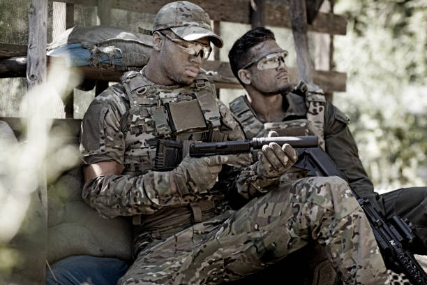 istock Group of 2 soldiers training in outdoor setting 815365362