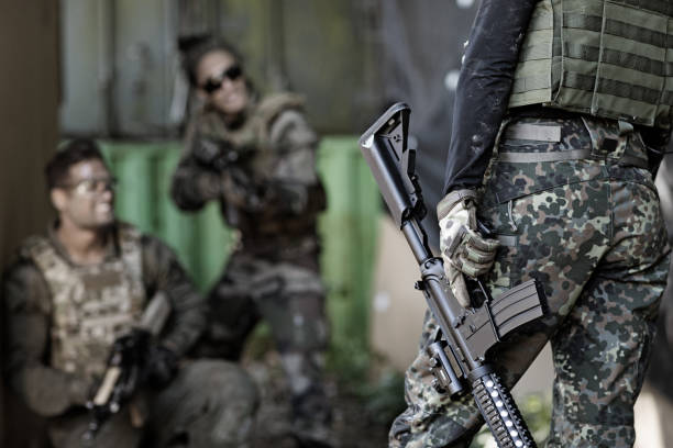 istock Group of 3 soldiers training in outdoor setting 815367844