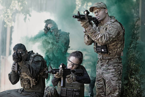 istock Group of 4 soldiers training in outdoor setting 815368022