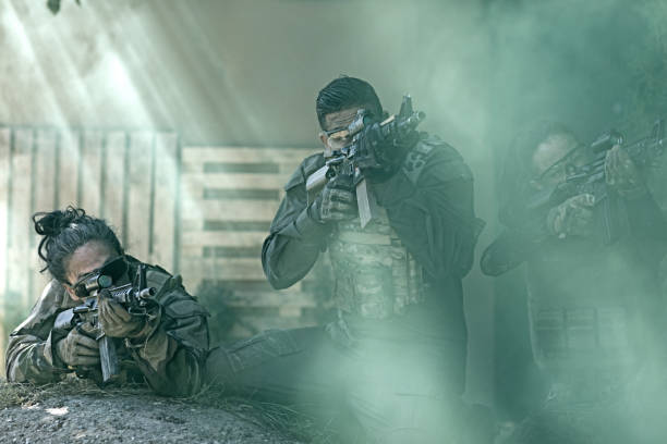 istock Group of 3 soldiers training in outdoor setting 815368110