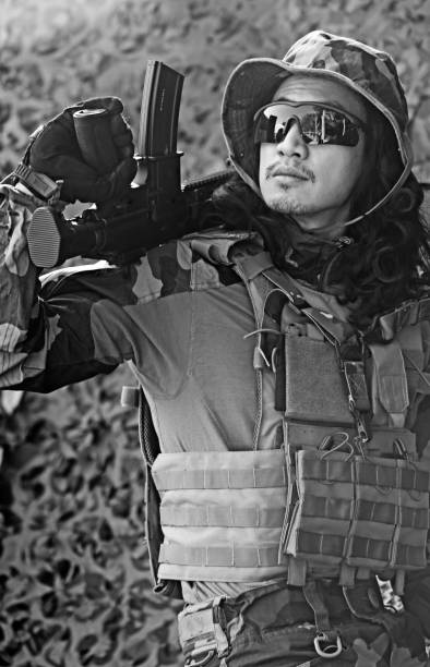 Lone Asian Male soldier in outdoor setting