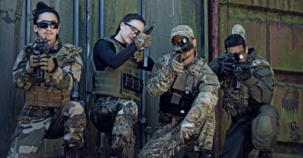 istock Group of 4 soldiers training in outdoor setting 815374502
