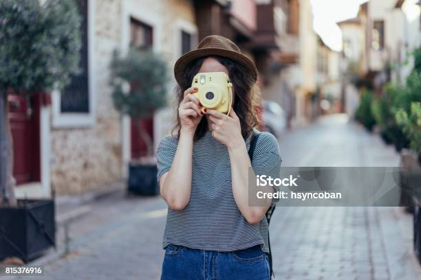 Young Girl Holding Instant Camera Stock Photo - Download Image Now - Instant Camera, Instant Print Transfer, Photographing