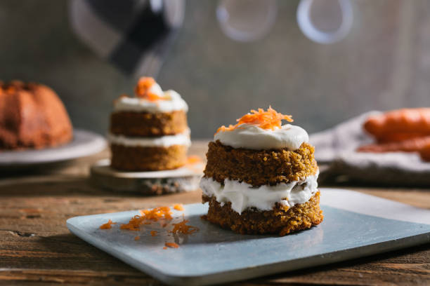 Mini carrot cake, stuffed with cream cheese, on blue concrete dish