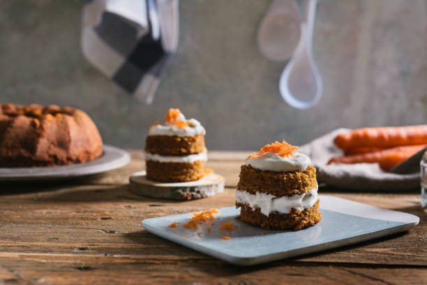 istock Mini carrot cake, stuffed with cream cheese, on blue concrete dish 815381638