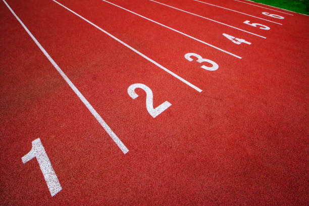 istock Red running track Synthetic rubber on the athletic stadium. 815393054