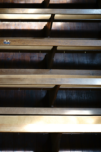 The top view on wooden benches and pews in a church.
