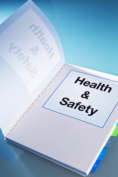 Opening a Health and Safety Manual Document Book Still Life