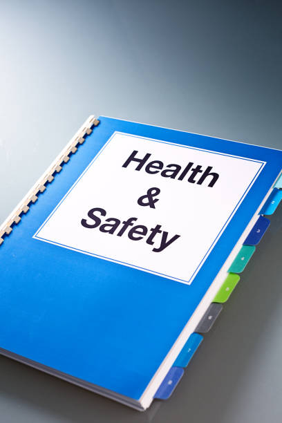istock Opening a Health and Safety Manual Document Book Still Life 815400912