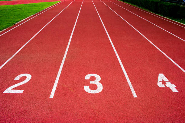 istock Red running track Synthetic rubber on the athletic stadium. 815403526