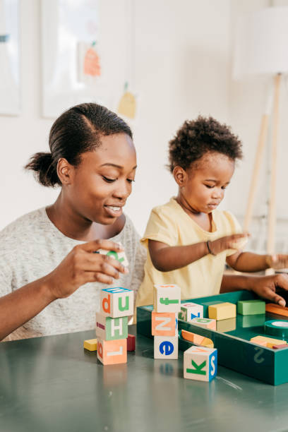 istock Toddler with wooden blocks 815408684