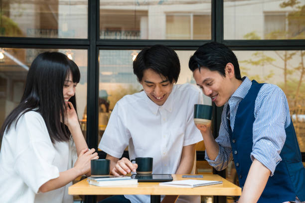 istock Three friends looking at a digital tablet together 815417176