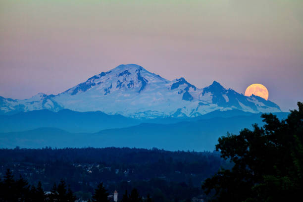 istock snow mountain with moonrise at sunset 815417446
