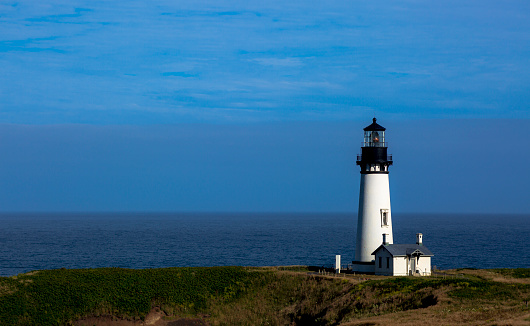 The Yaquina Light is the tallest lighthouse in Oregon. At 93 feet, it stands on the point of the Yaquina Head that extends one mile in to the Pacific.