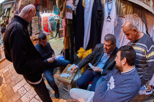Jerusalem - 04.04.2017: Local people gamble playing cards in Jerusalem stock photo