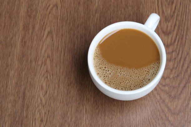 istock Hot coffee in a white Coffee cup on wooden table at coffee shop. 815433154