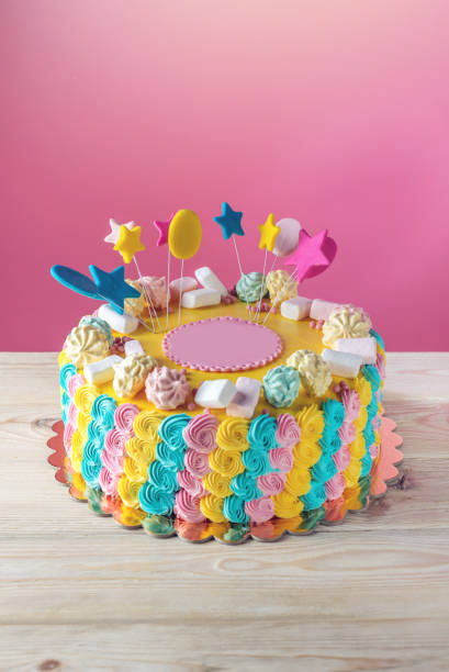istock Colourful children's cake decorated with marshmallows and meringues 815451064
