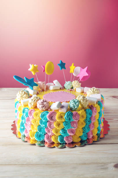 istock Colourful children's cake decorated with marshmallows and meringues 815451086