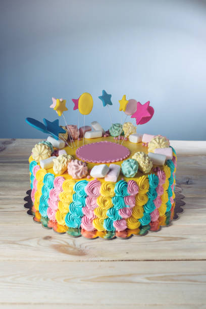 istock Colourful children's cake decorated with marshmallows and meringues 815451100