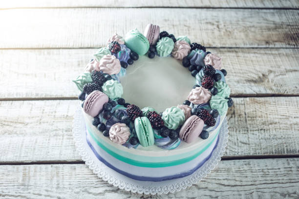 istock Homemade cake with berries blackberries, blueberries, meringue and marshmallows 815451108