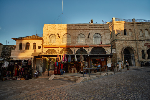 Jerusalem - 04.04.2017: Tourists walk trough the market in the old city of Jerusalem