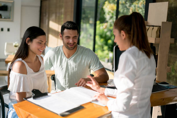 istock Couple doing the check-in at a hotel 815458390
