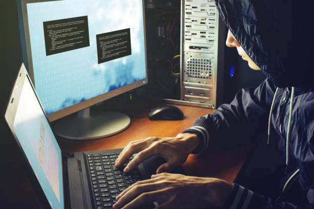 istock hacker in the dark breaks the access to steal information 815477648