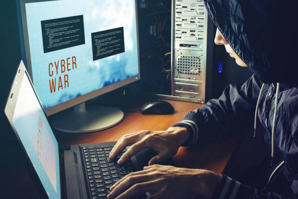 istock hacker in the dark breaks the access to steal information 815477666